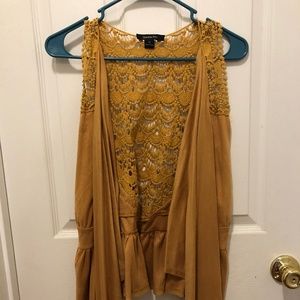 Sleeveless, open, flowy cardigan